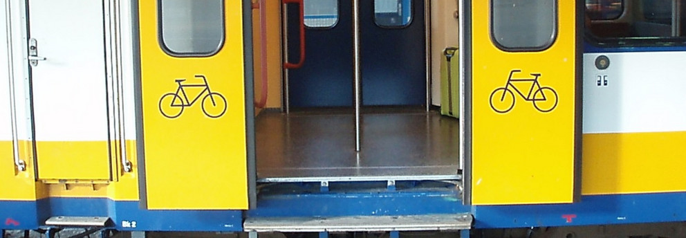 a local train with a door for a bicycle compartment